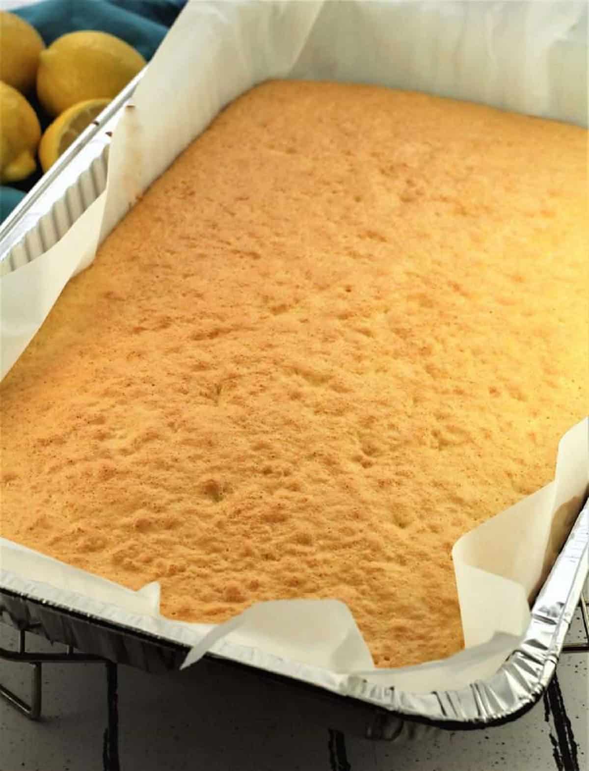 Lemon vanilla slab cake in pan.