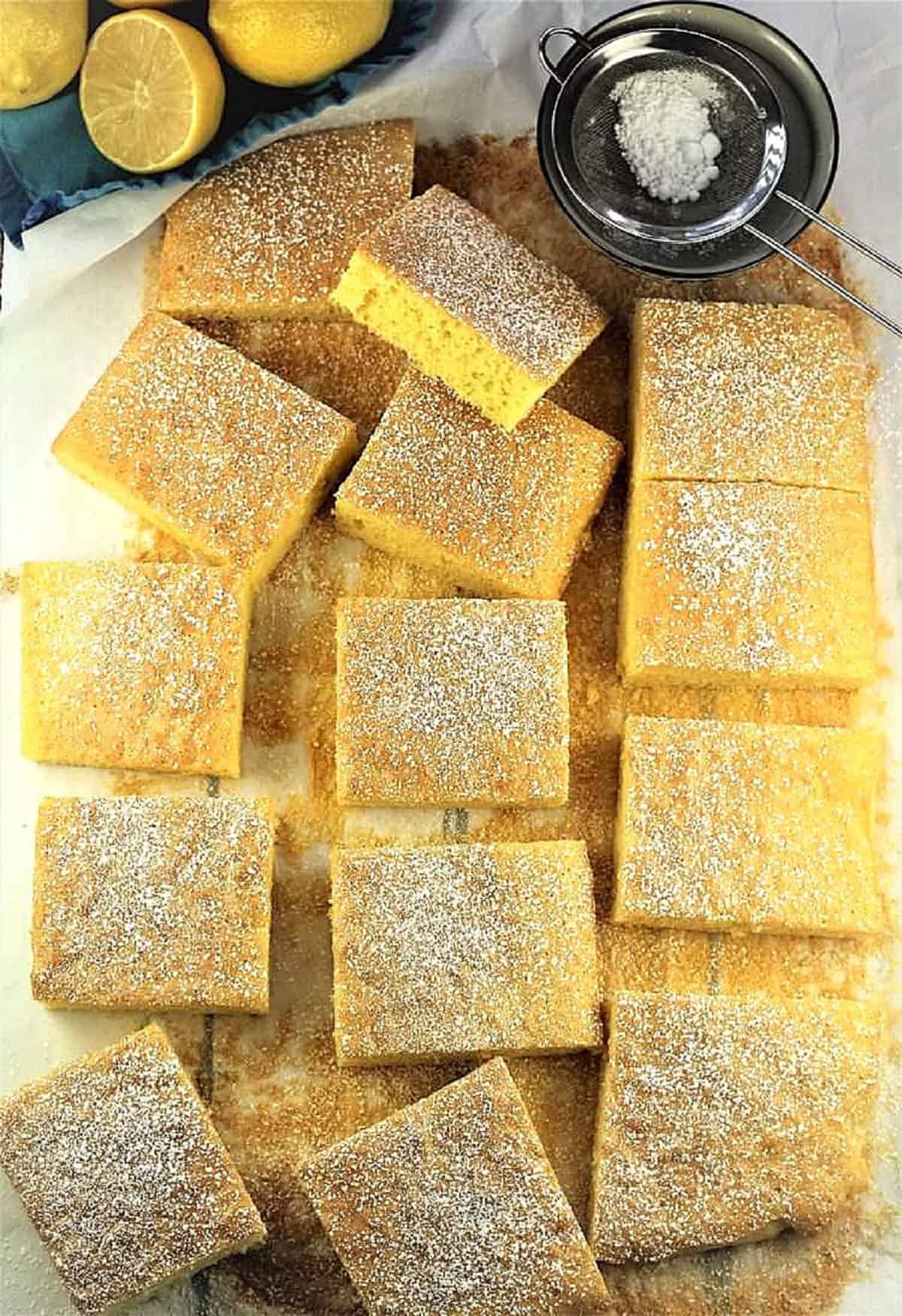 Lemon-Vanilla Snack Cake Lemon vanilla flavord sheet pan cake cut into squares.