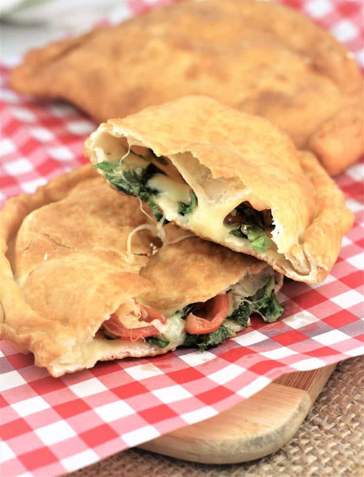 pitoni messinesi (Sicilian Fried Calzone) cut in half to reveal filling