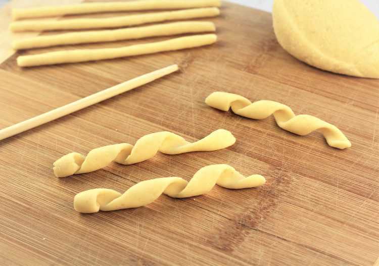 homemade busiate pasta with wooden skewer