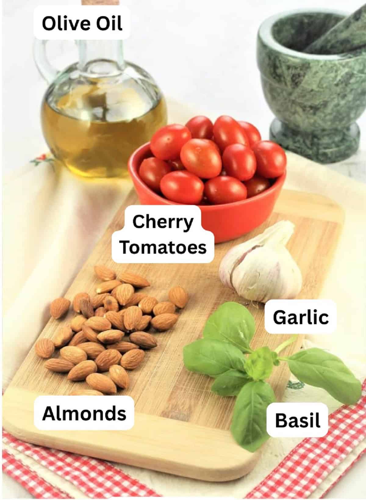 Pesto alla Trapanese (Sicilian Pesto) Olive oil, cherry tomatoes, garlic, basil and almonds for Sicilian pesto.