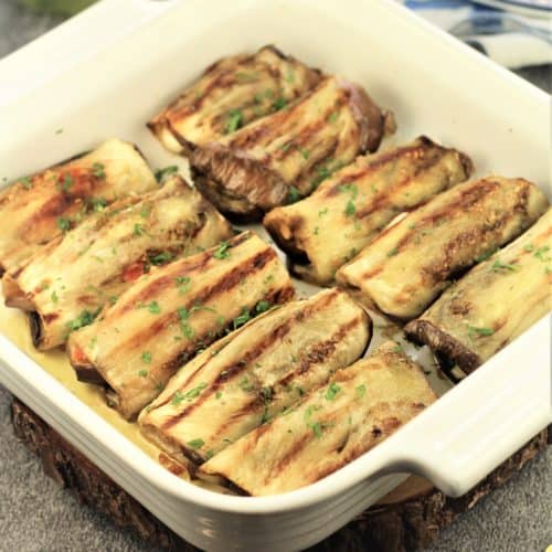 grilled eggplant involtini in a square baking dish