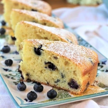 slices of blueberry olive oil cake on rectangular plate
