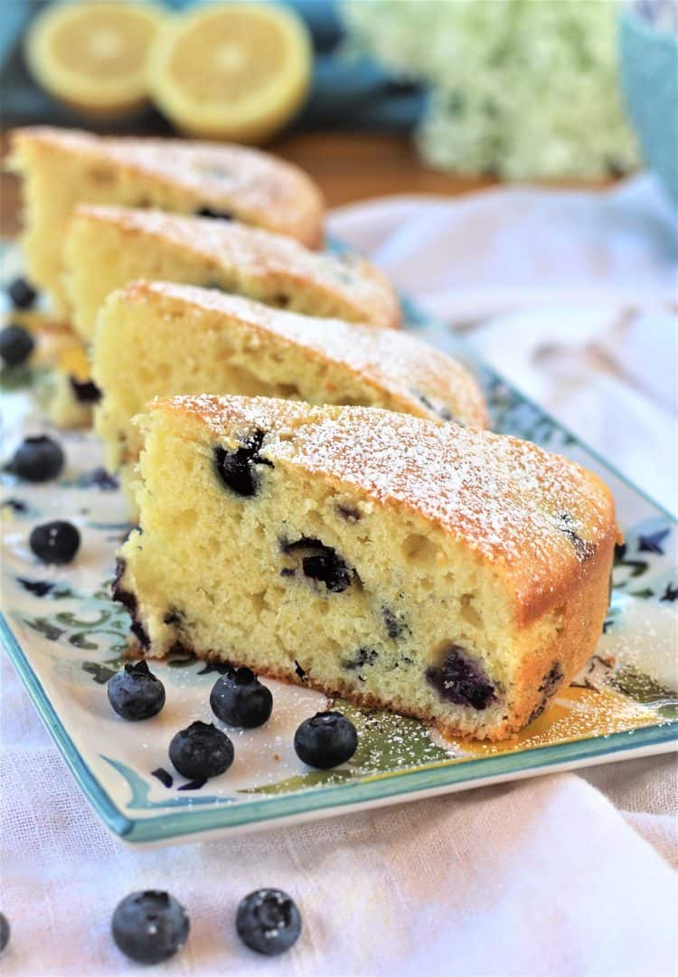 slices of blueberry olive oil cake on rectangular plate