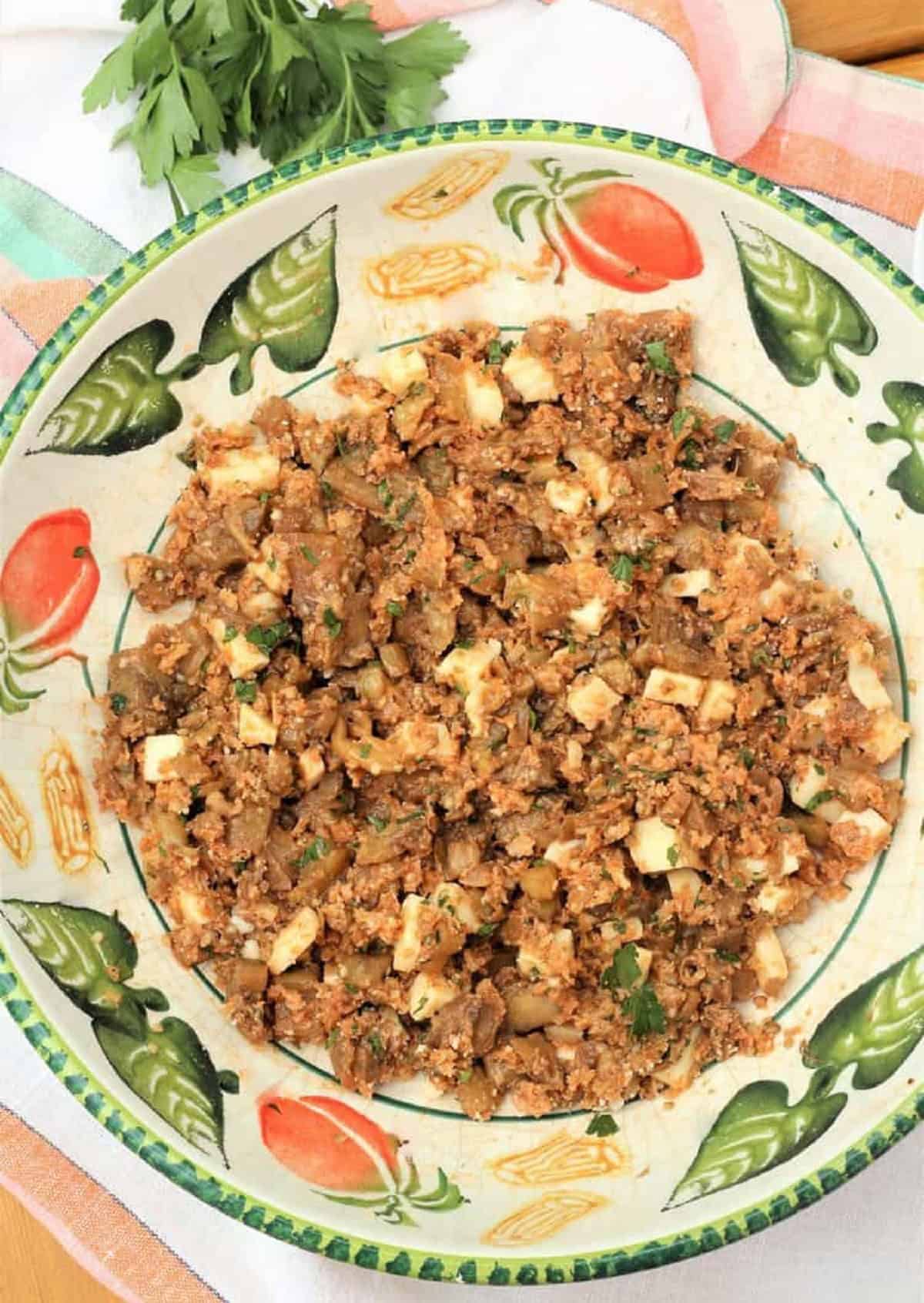 Eggplant, breadcrumb and cheesy stuffing in large mixing bowl.