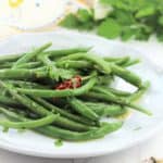 italian green bean salad in white plate