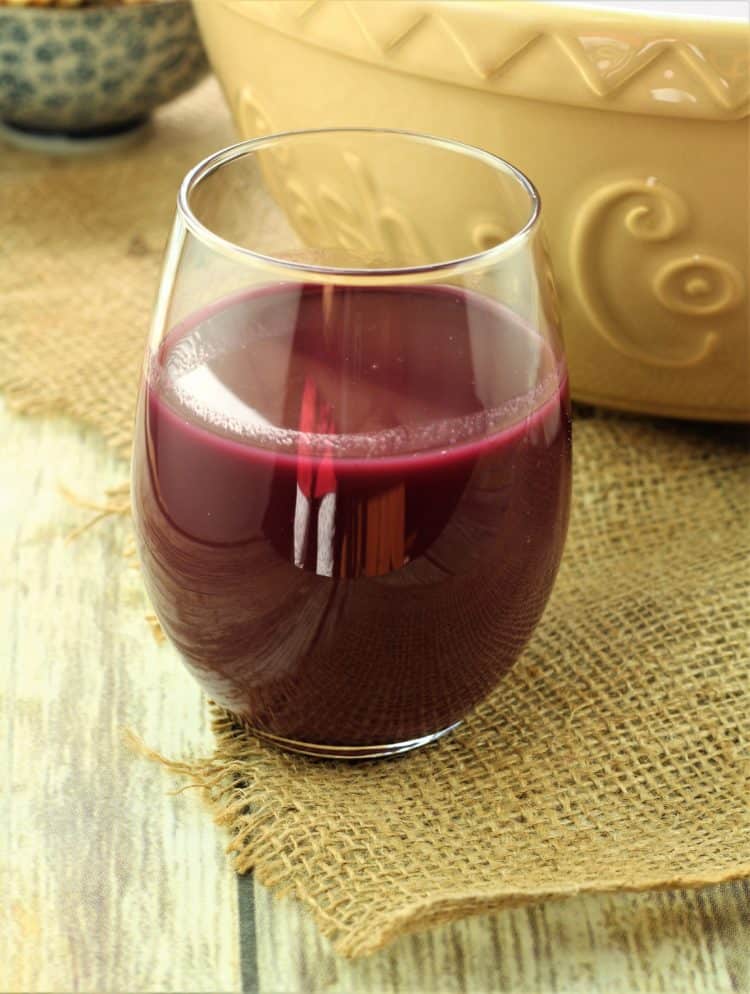 glass with strained grape must