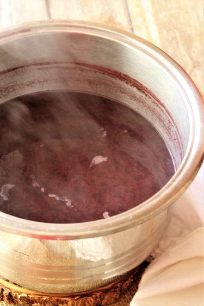 pot filled with steaming grape must