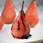 red wine poached pear drizzled with syrup