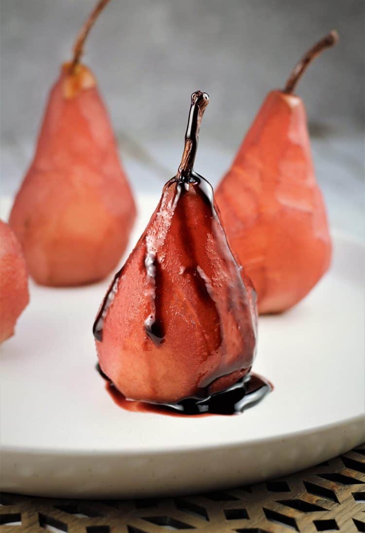 red wine poached pear drizzled with syrup