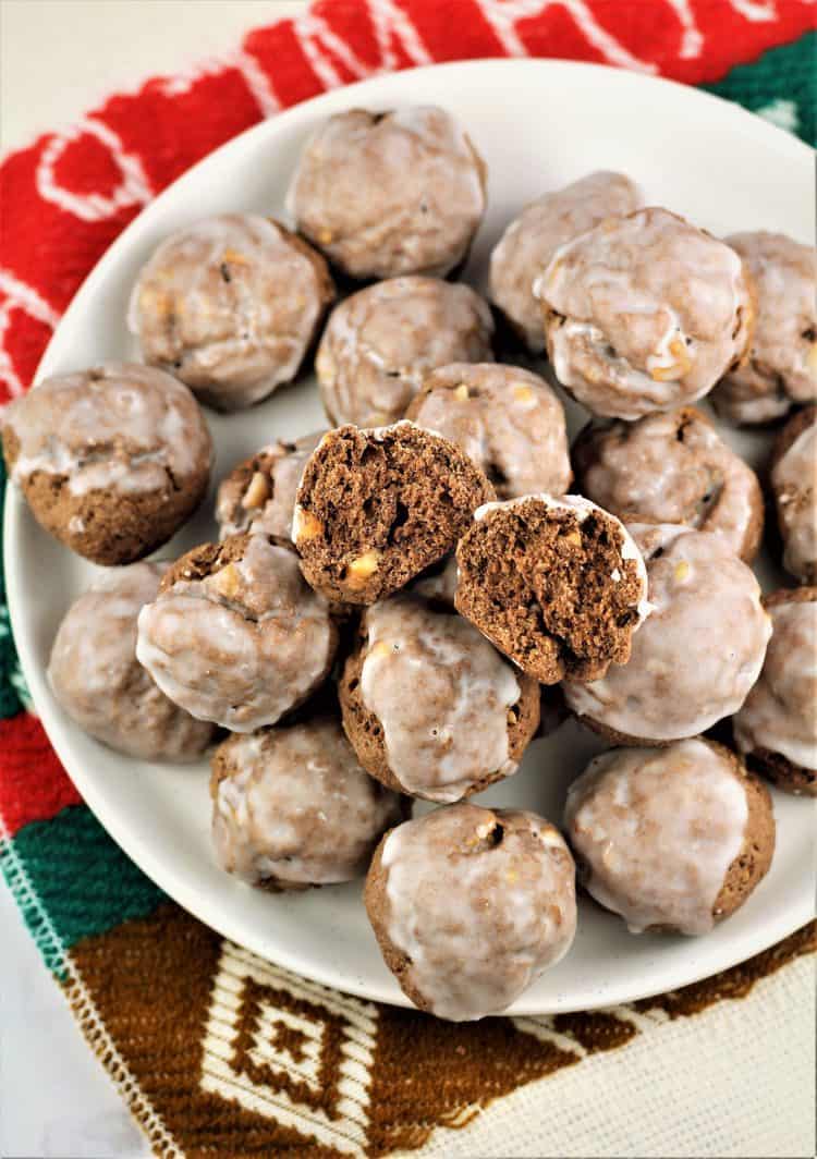 overhead view of tetù cookies on white plate with one cookie cut open