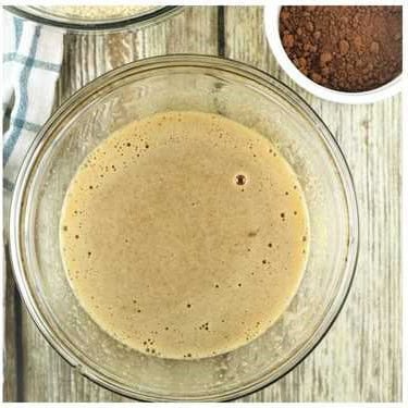 Beaten eggs, sugar and espresso coffee for amaretti recipe.