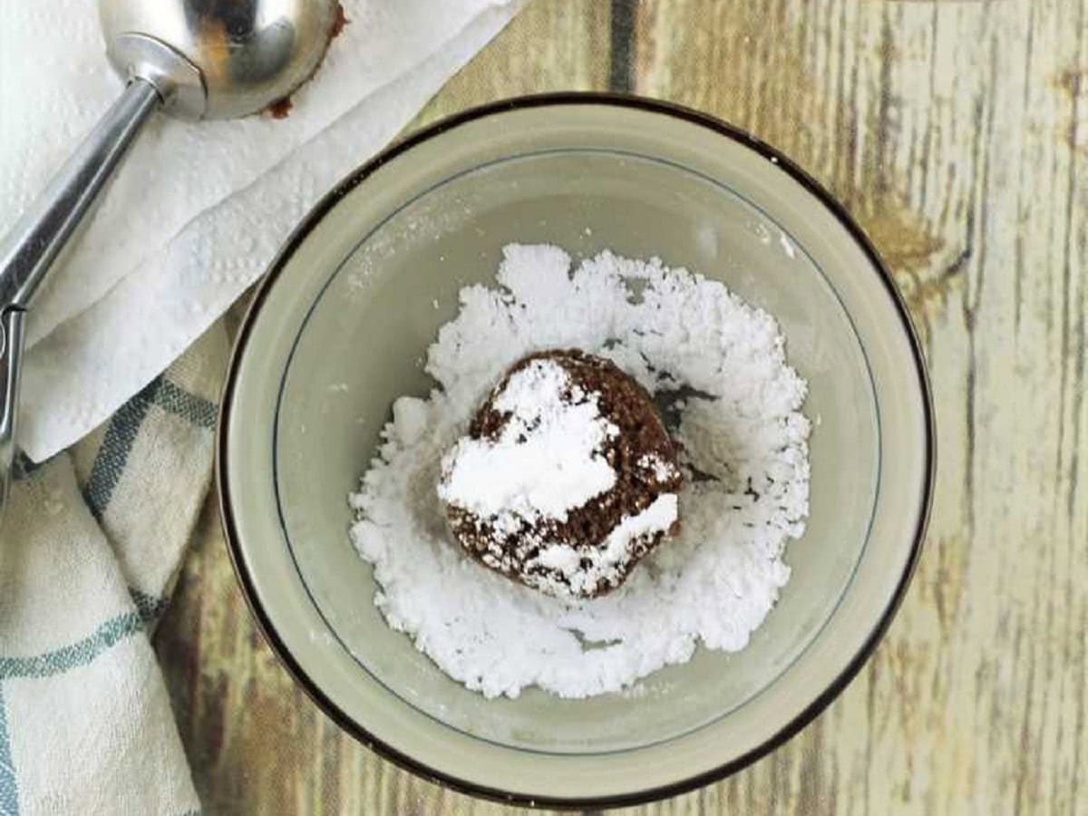 Chocolate espresso amaretti cookie balls rolld in powdered sugar.