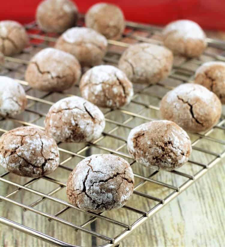 Chocolate espresso amaretti cookies on cooling rack.