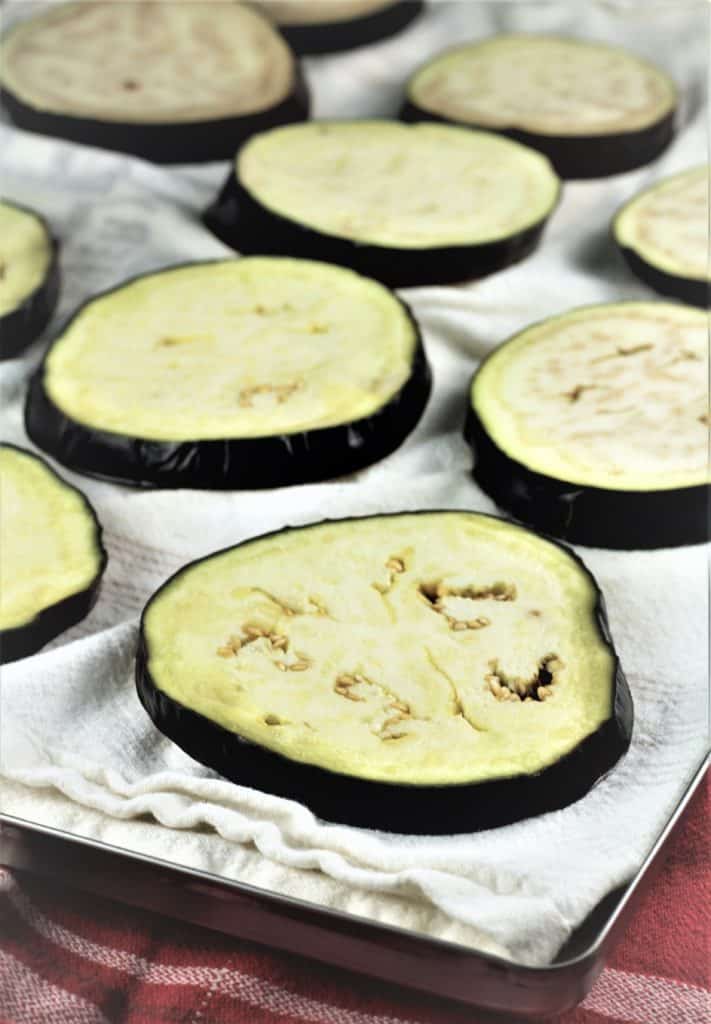 boiled eggplant rounds on dish cloth