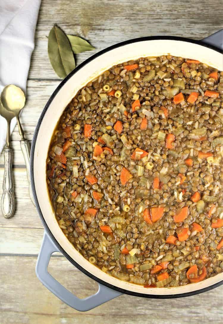 overhead view of skillet with lentils and rice on wood surface