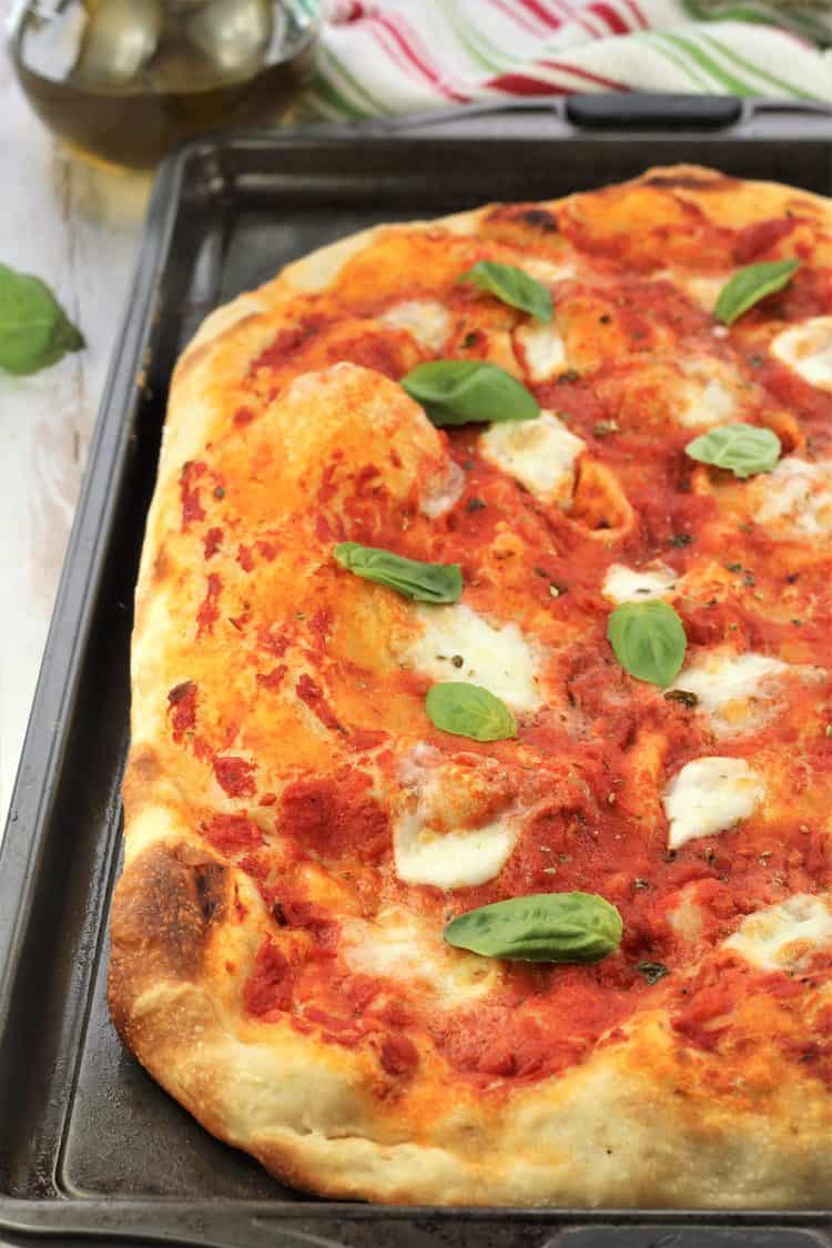 no knead pizza Margherita on baking sheet