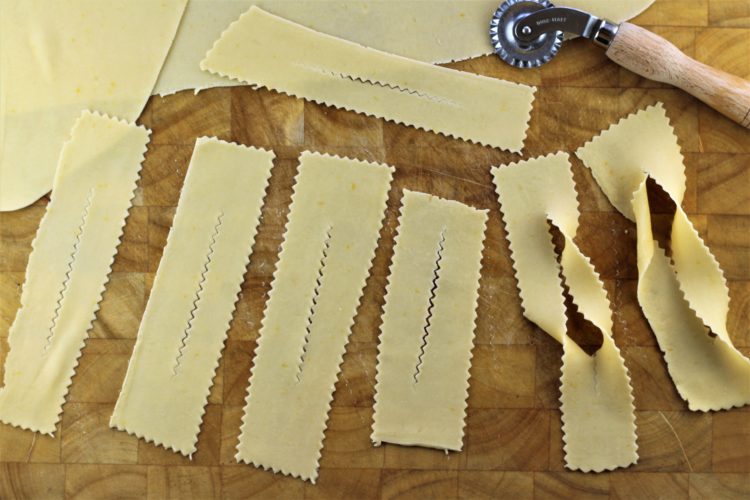 strips of dough shaped into chiacchiere 