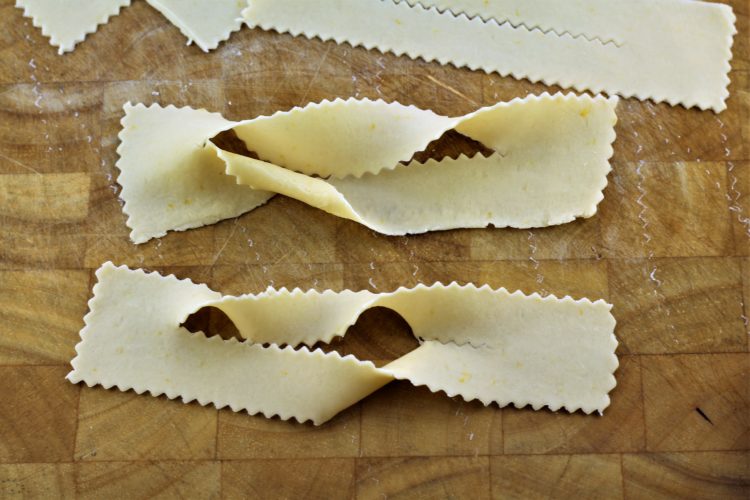 dough strips shaped into chiacchiere