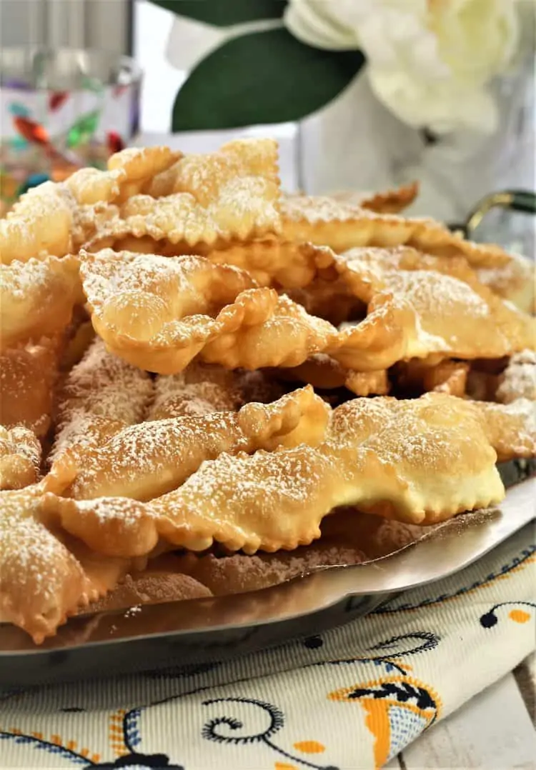 chiacchiere piled onto a silver tray