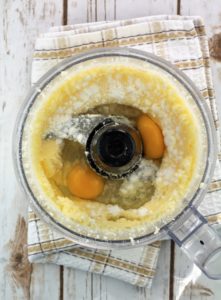 eggs added to creamed butter and sugar in bowl of food processor