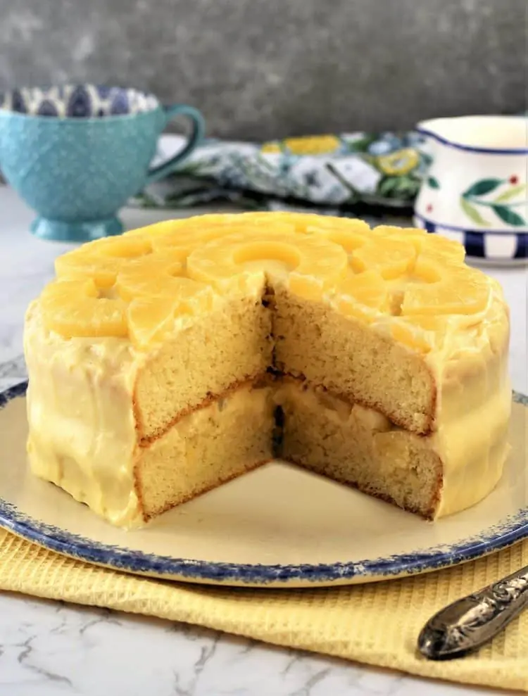 pineapple layer cake with pastry cream cut open to reveal inside layers