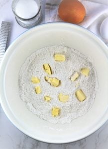 mixing bowl filled with flour and cubed butter