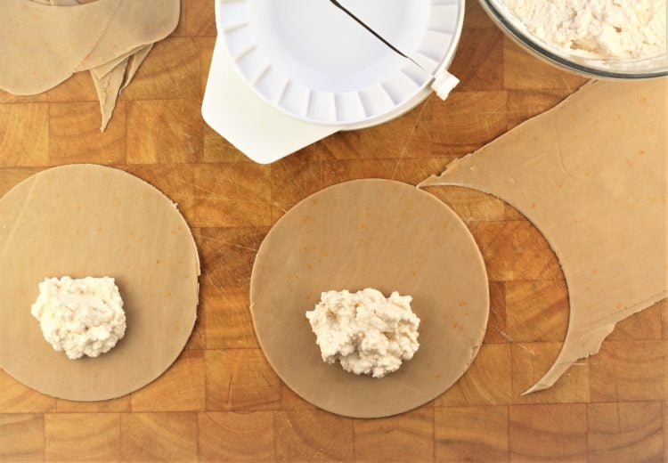 round dough pieces with dollop of ricotta in the center