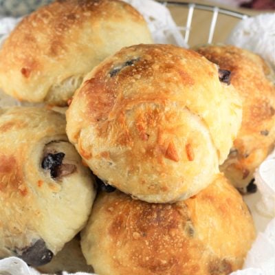 olive and cheese buns in a breadbasket