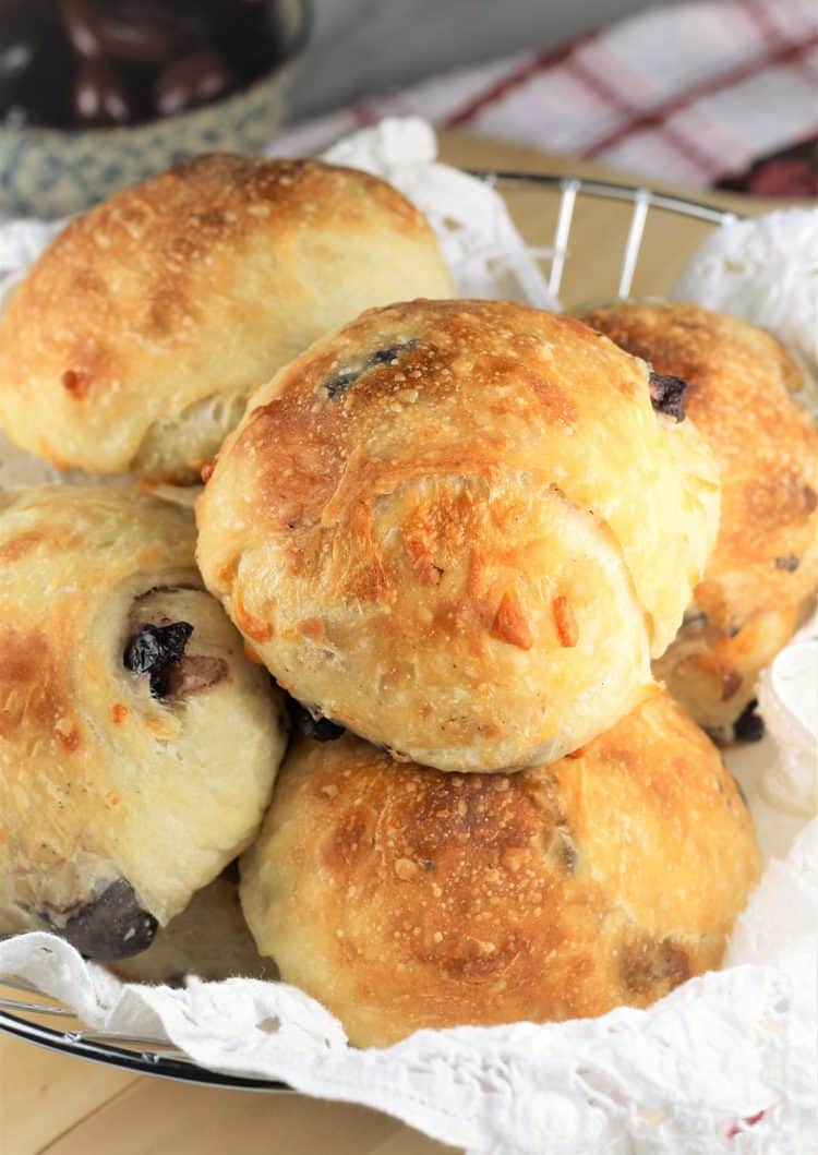 olive and cheese buns in a breadbasket