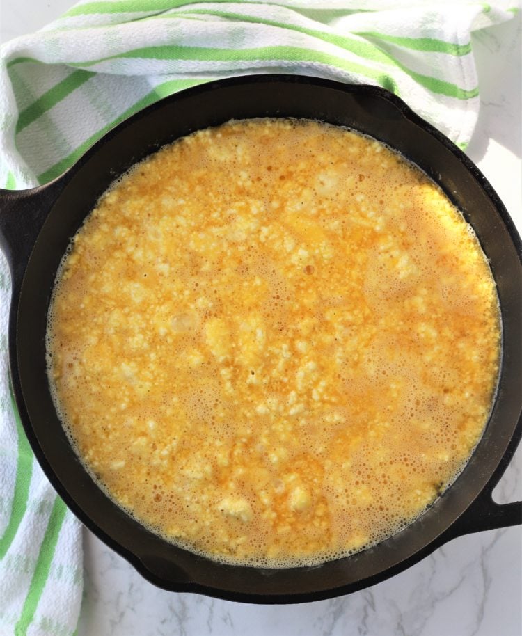 eggs with ricotta omelet in cast iron skillet 