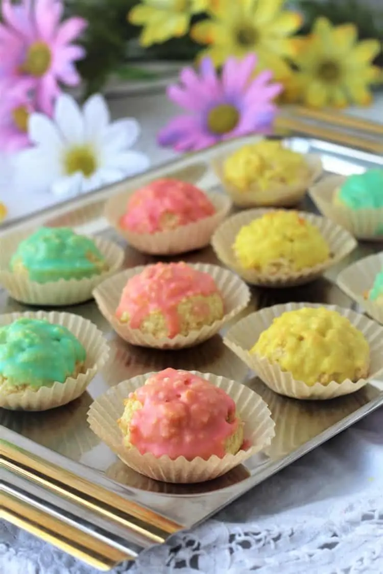 tray of colorful iced almond paste cookies
