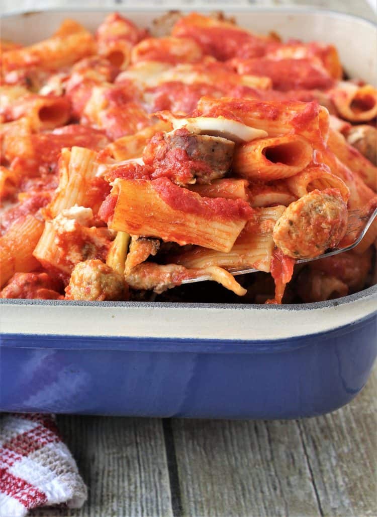 blue casserole with pasta in tomato sauce with meatballs 