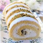 ricotta and pistachio roll cake on serving platter