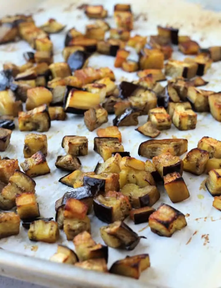 roasted eggplant cubes on baking sheet 