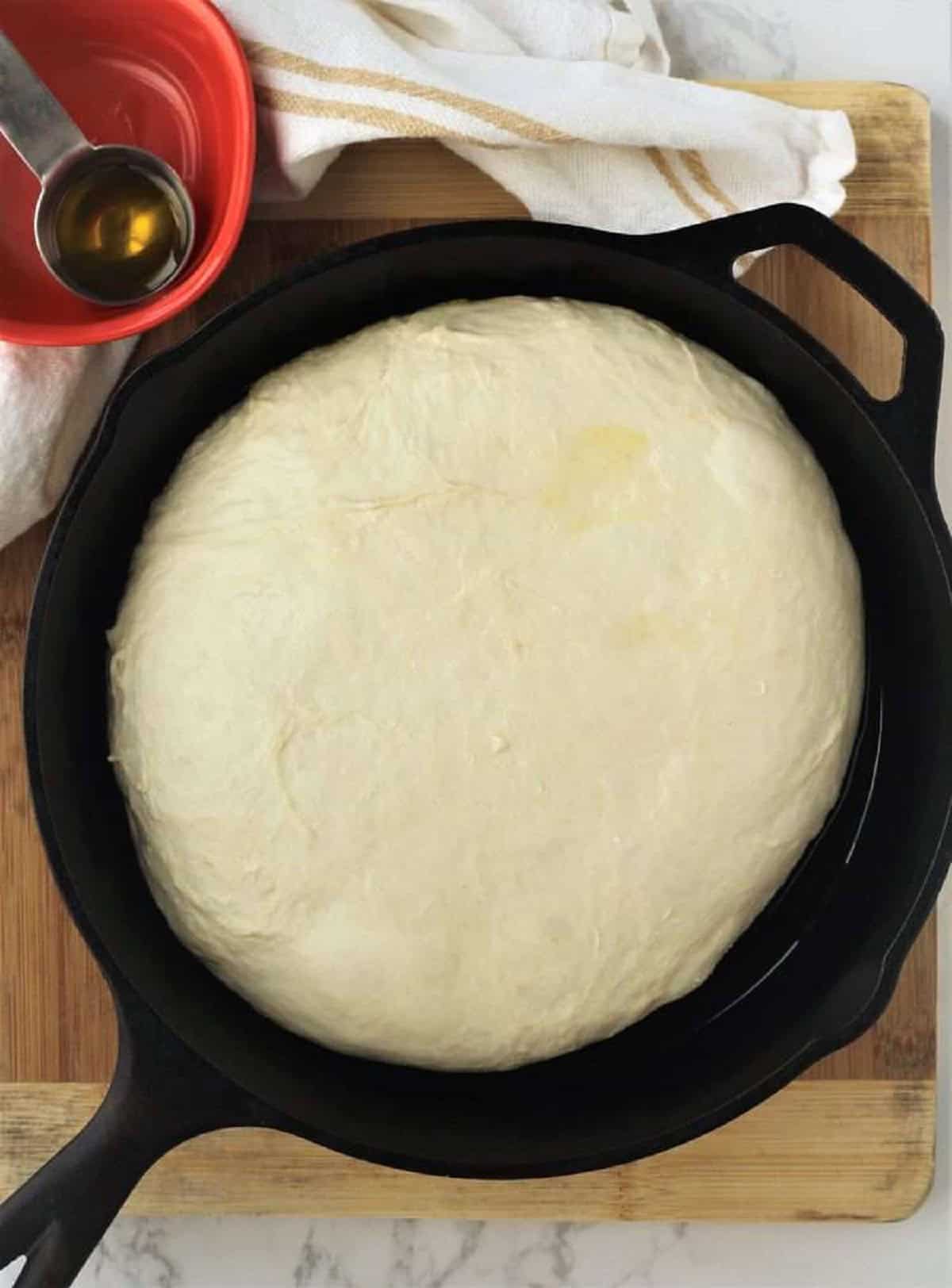 No knead focaccia dough in cast iron skillet.