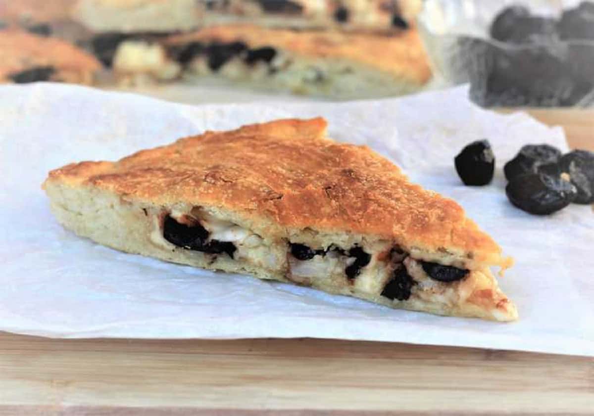 Scacciata with Cauliflower and Black Olives (No Knead Recipe) Slice of cauliflower and black olive filled scacciata.