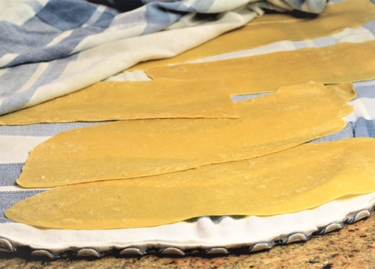 sheets of rolled pasta dough on table cloth