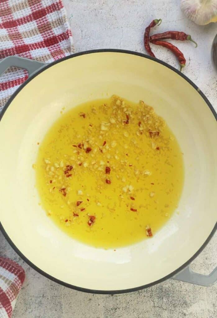 Sautéed garlic and pepperoncino in oil for green bean pasta.