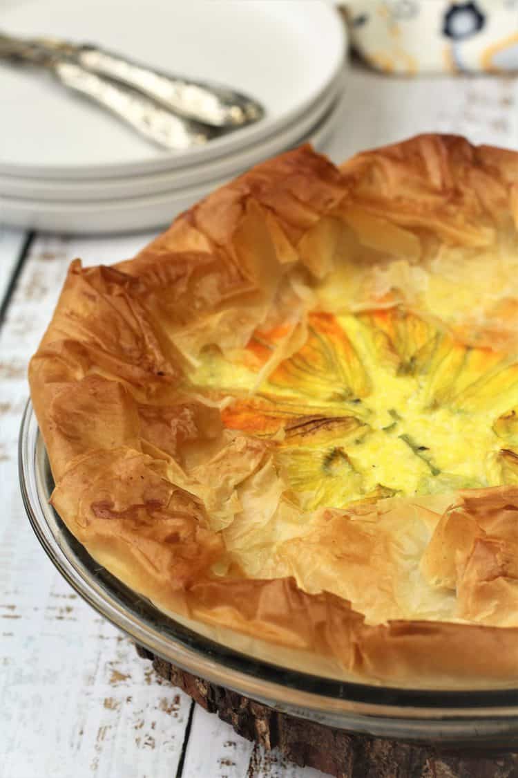 filo dough tart filled with zucchini blossoms and ricotta filling