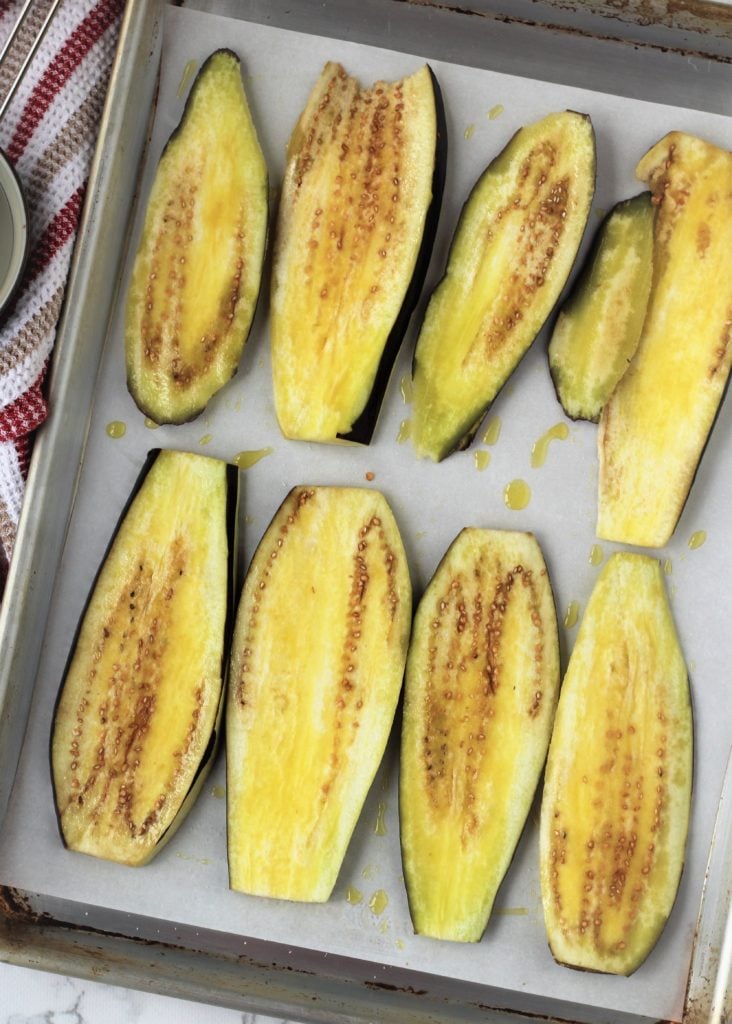 eggplant slices brushed with oil on baking sheet