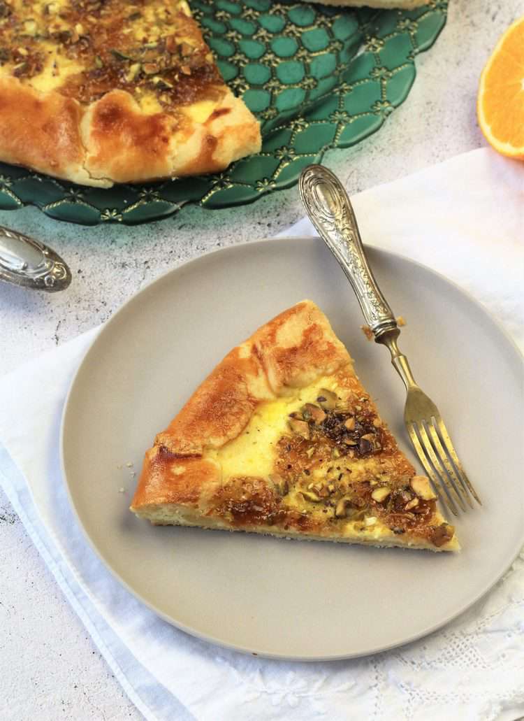 wedge of crostata served on plate with fork