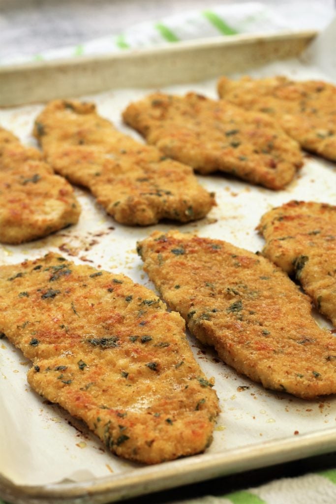 baked golden chicken cutlets on baking sheet