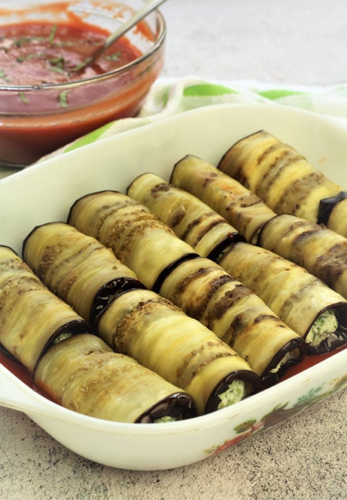 eggplant involtini arranged in baking dish