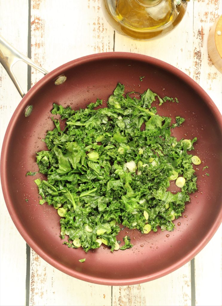 skillet filled with sautéed kale 