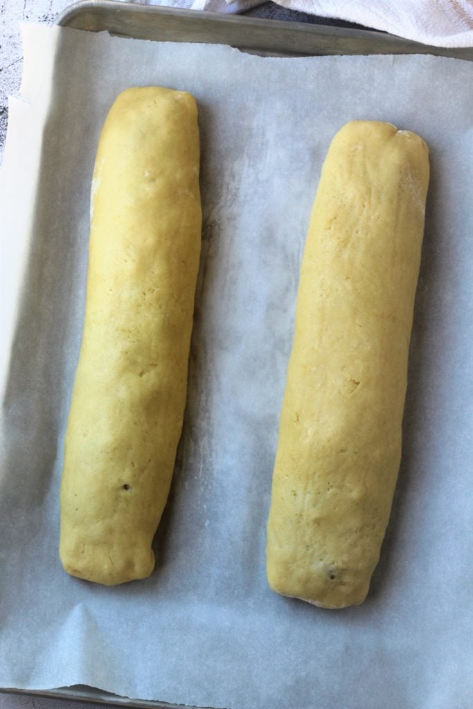 rolled cookie logs on baking sheet