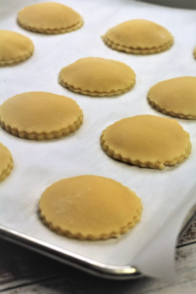 round genovesi cookies on baking sheet