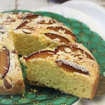 Italian plum almond cake slice cut from whoe cake.