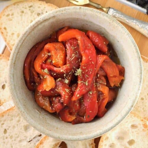 Roasted red bell pepper strips in bowl.