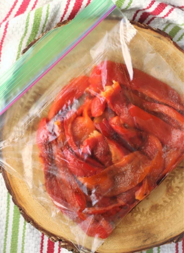 Roasted red pepper strips in freezer bag.